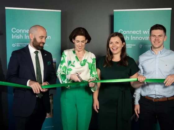 image of staff cutting a green ribbon at the Australia branch