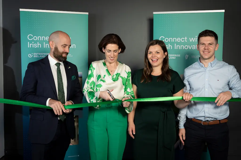 image of staff cutting a green ribbon at the Australia branch