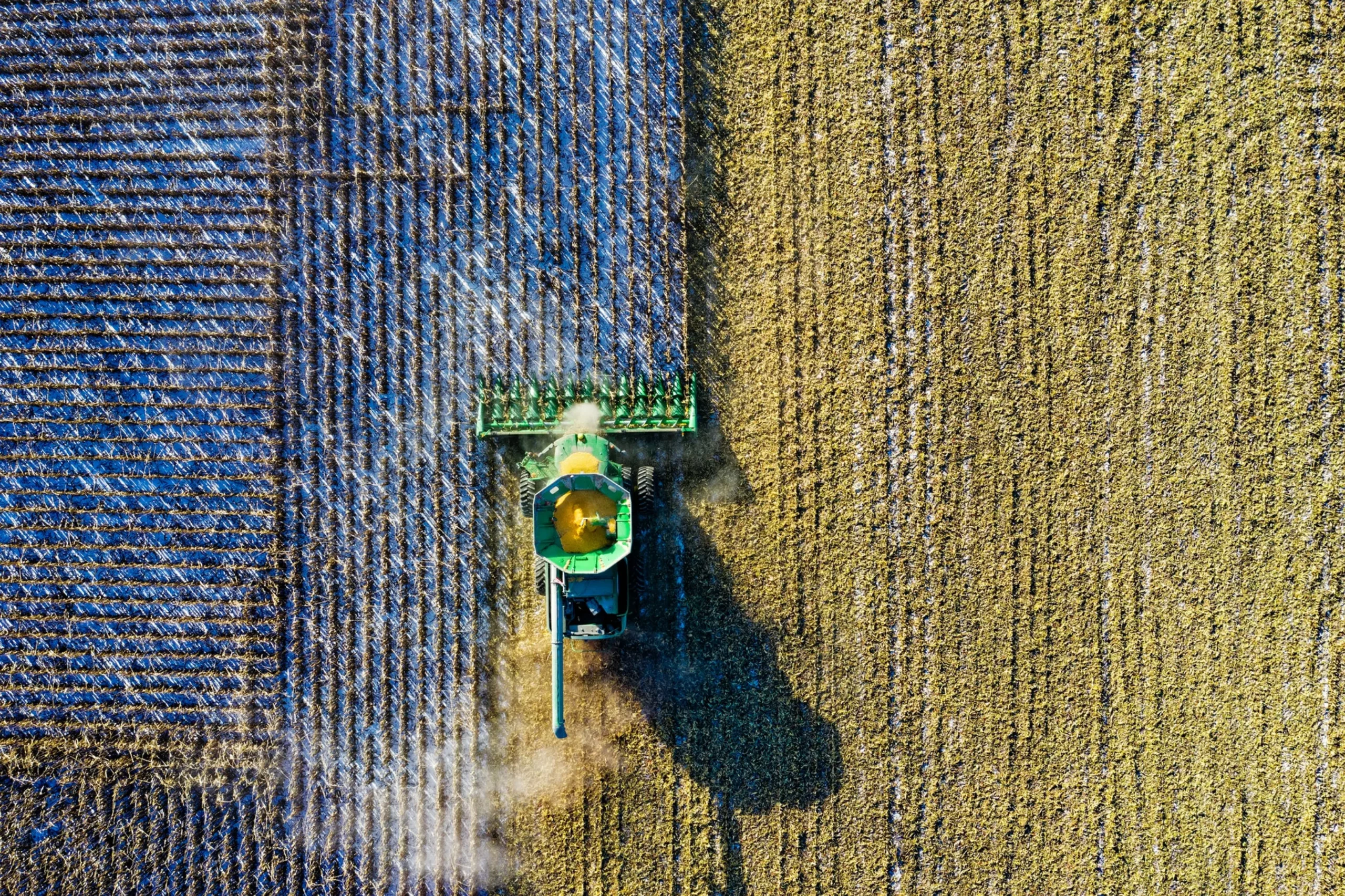 image of a tractor from above harvesting a field