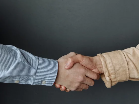 image of two people shaking hands