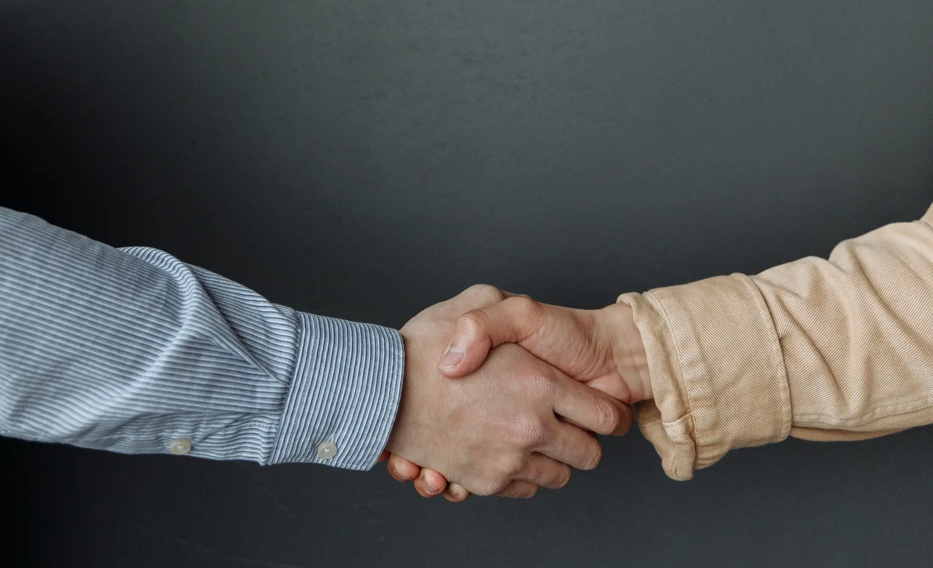 image of two people shaking hands