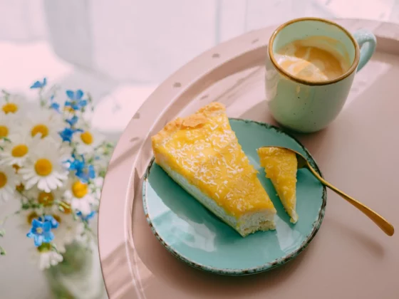 image of a portion of cake with a hot cup of coffee