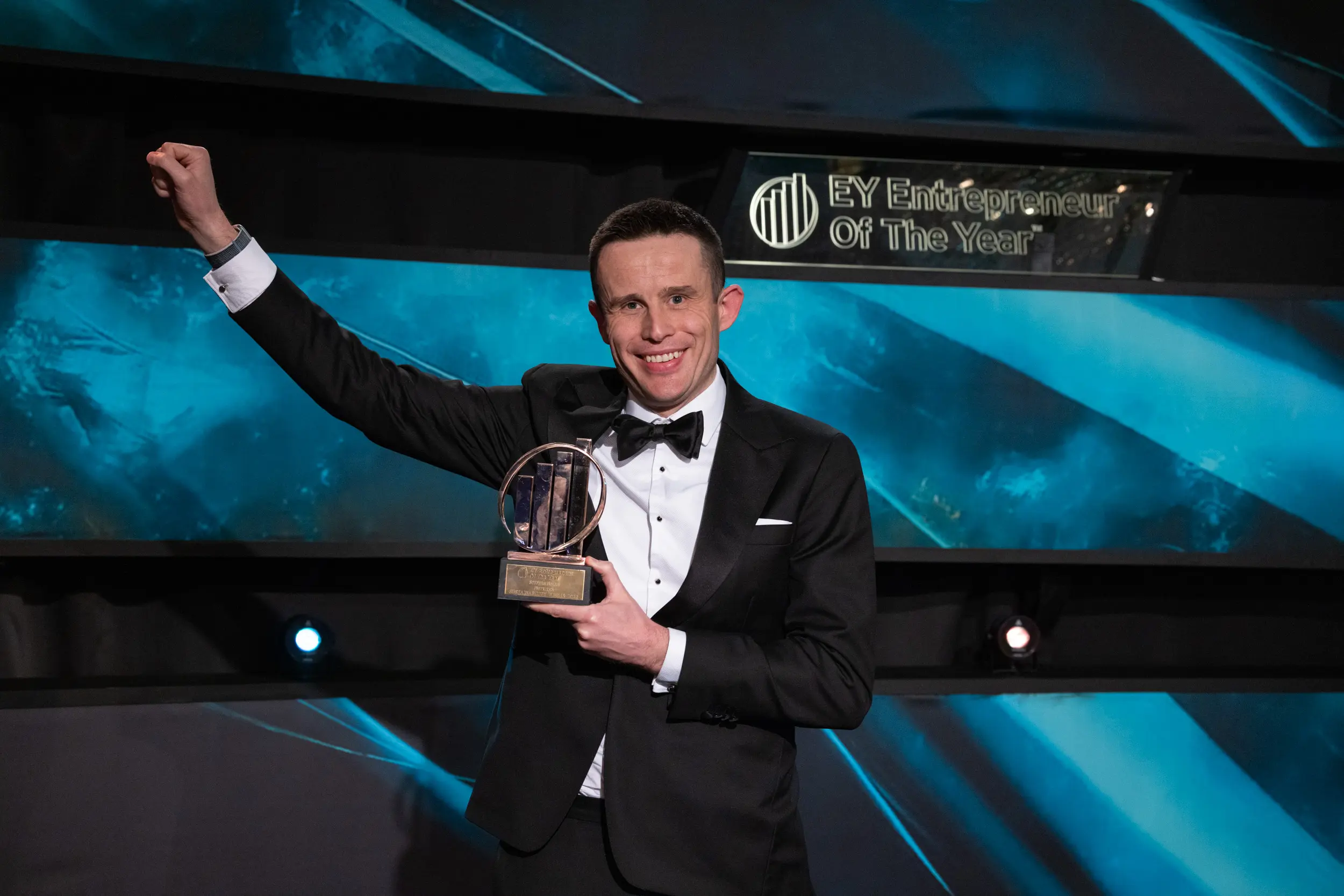 stephen nolan accepting award while wearing a tuxedo