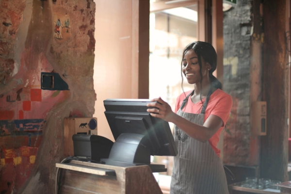 woman smiling using point of sale