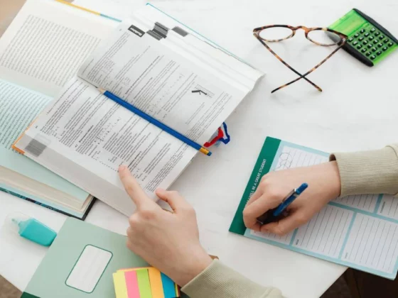 image of someone working on documents on a table