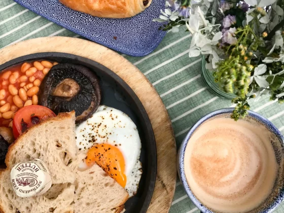 english cooked breakfast with a flat white