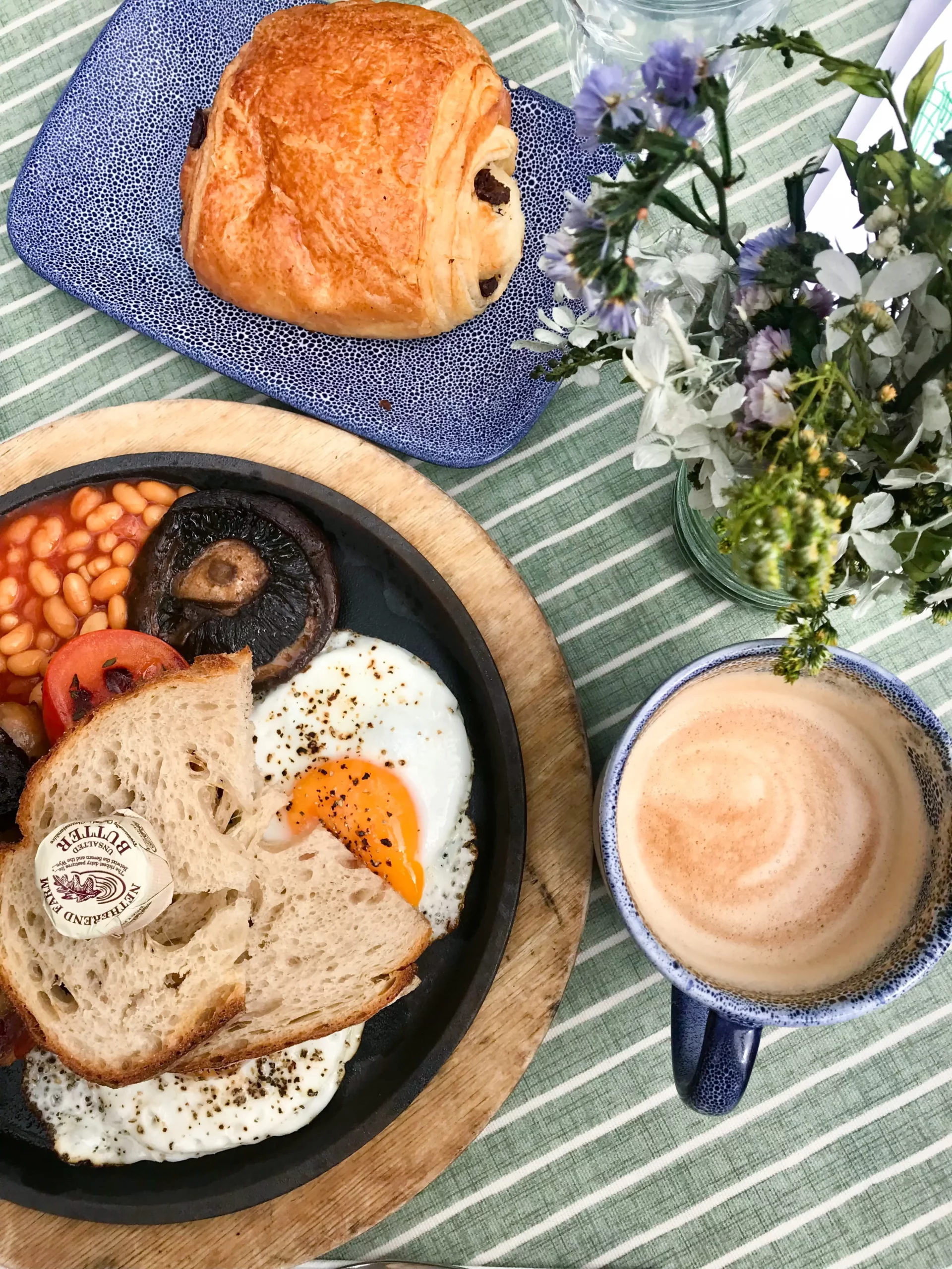 english cooked breakfast with a flat white