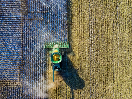 image of a tractor from above harvesting a field