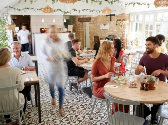 Busy waiters in restaurant