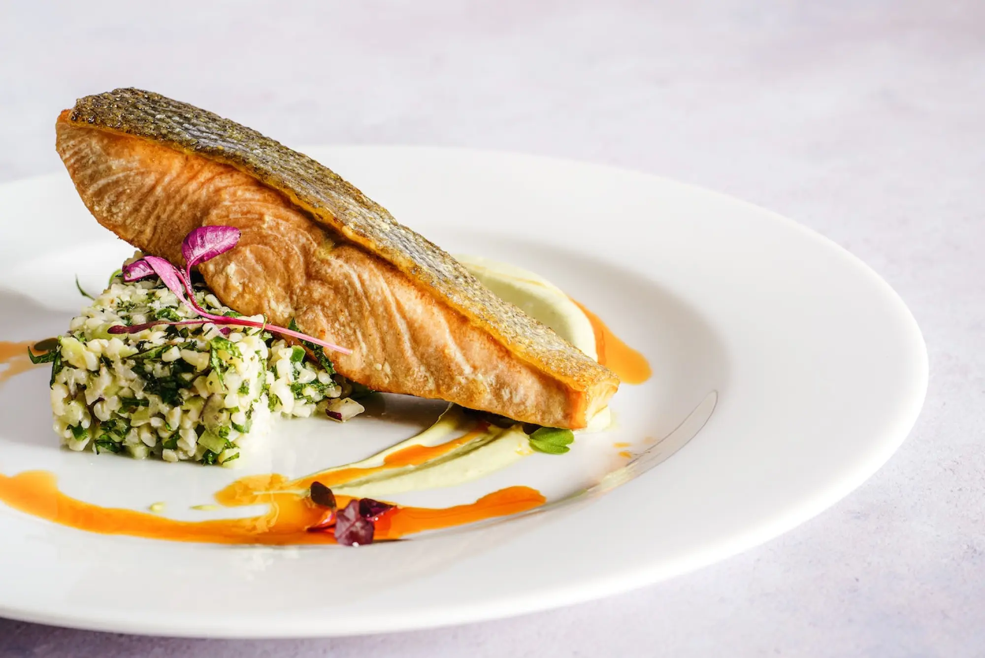 salmon on a plate with vegetables