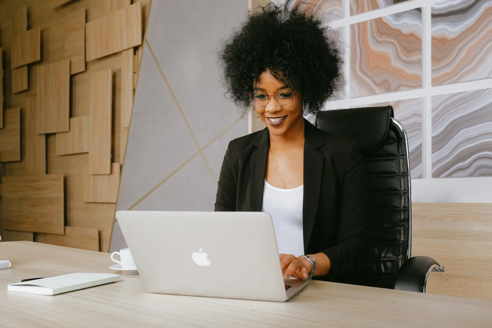 woman smiling using laptop