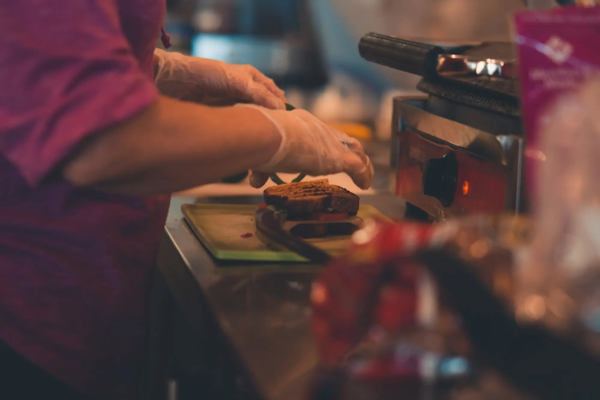 close up of someone working in a coffee shop