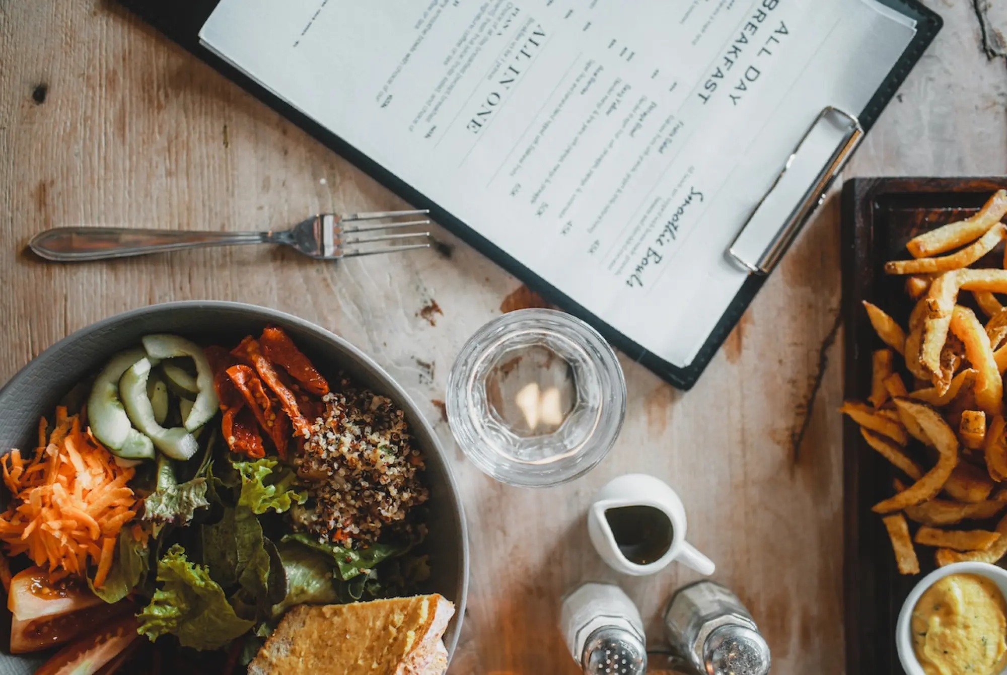 food and menu on a table