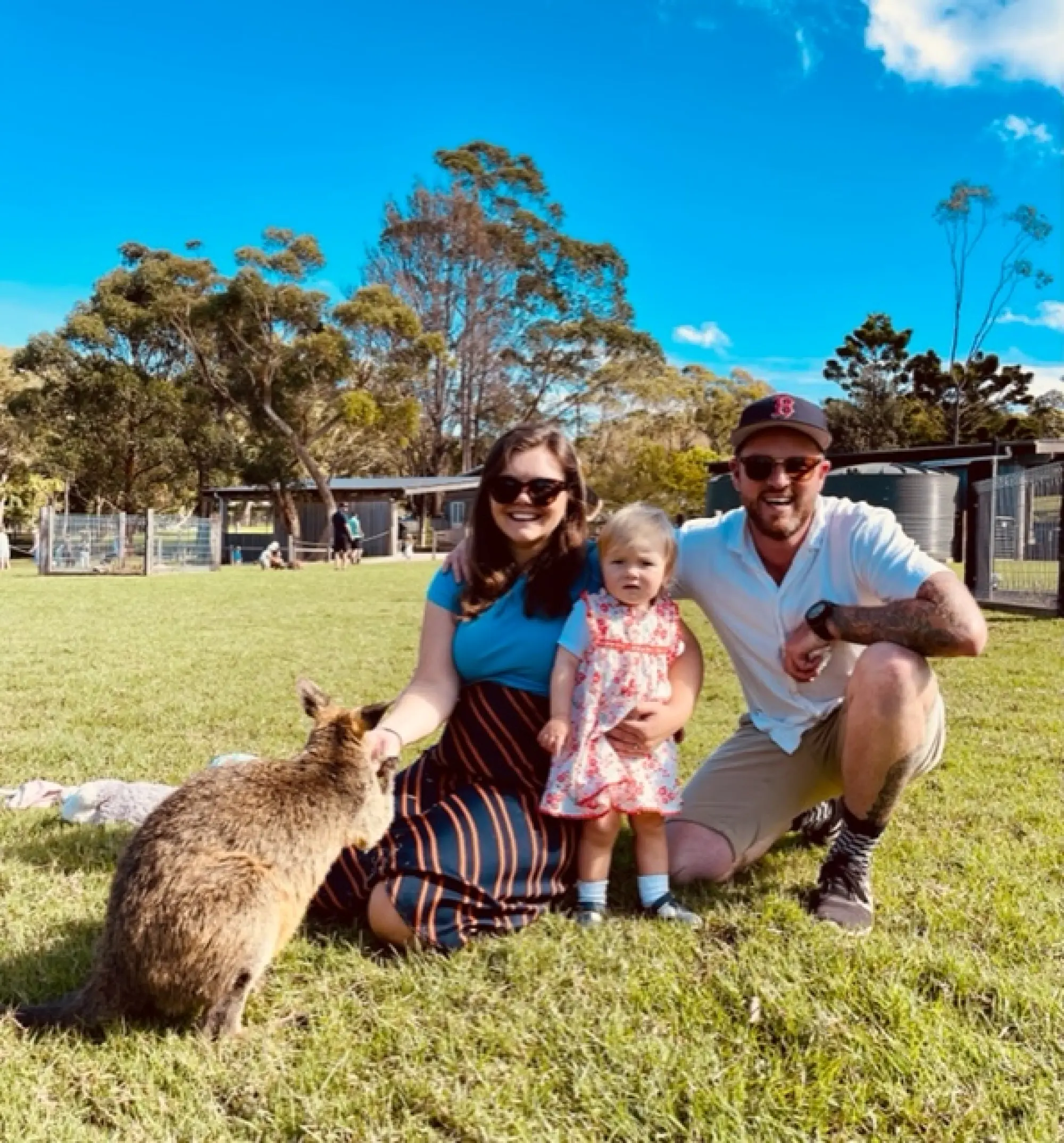 megan ratcliffe shot with her family feeding a kangaroo