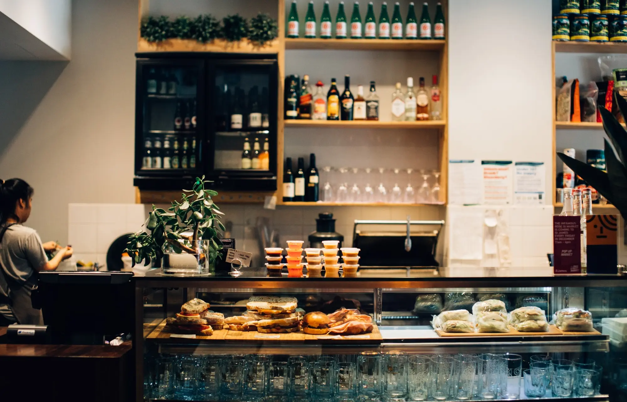 restaurant counter top with food arranged behind