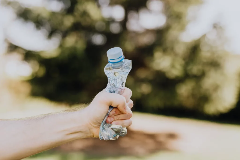 empty water bottle being squeezed