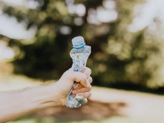 empty water bottle being squeezed