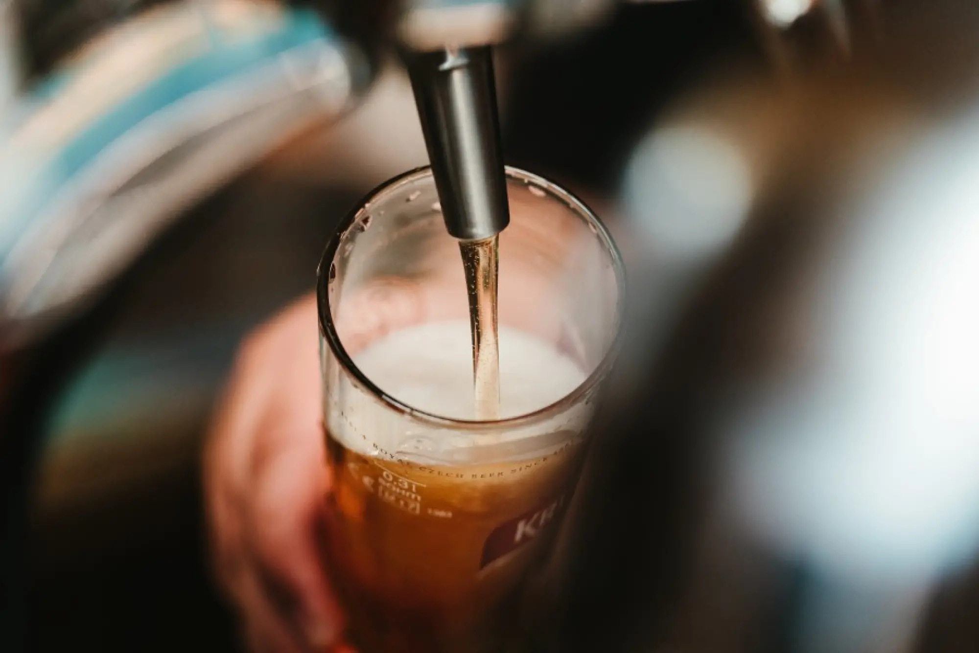 beer being poured from a pump