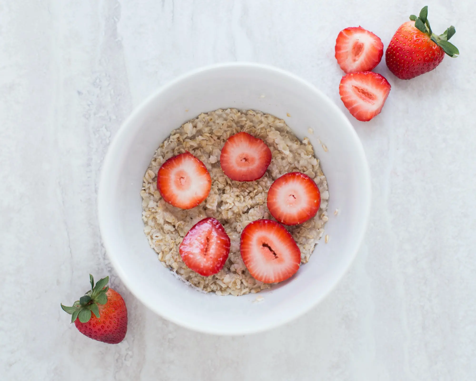 bowl of oats with strawberries