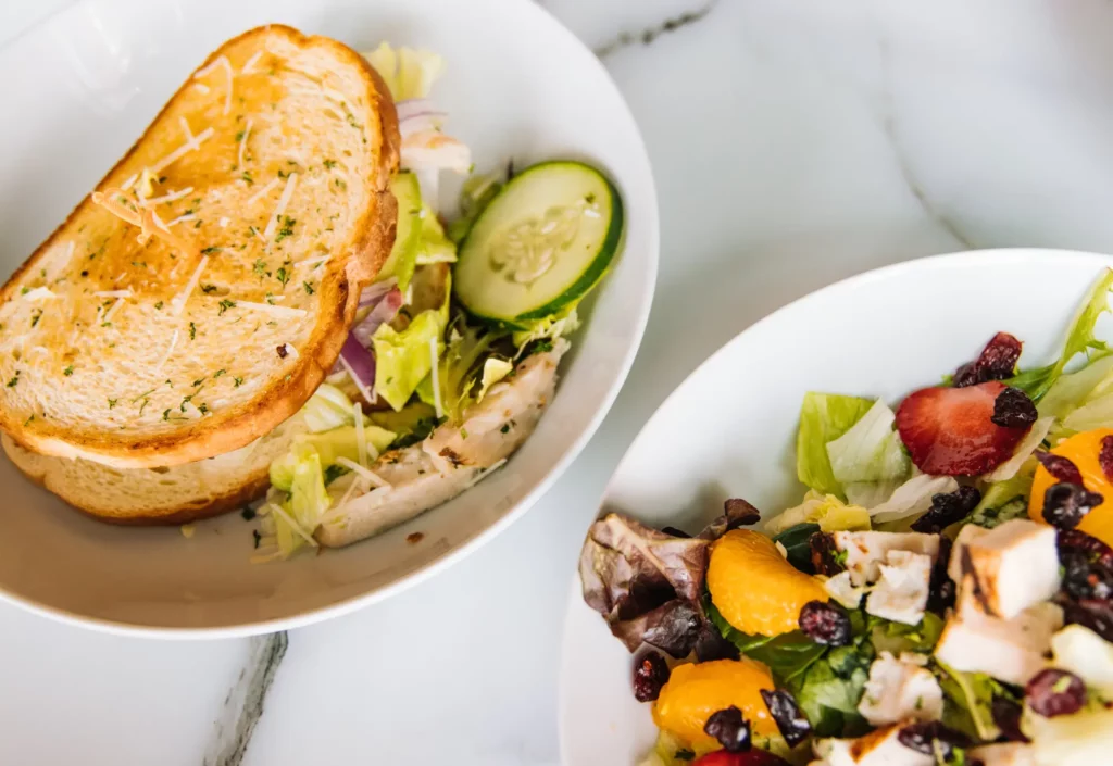 image of sandwiches with salad on a table