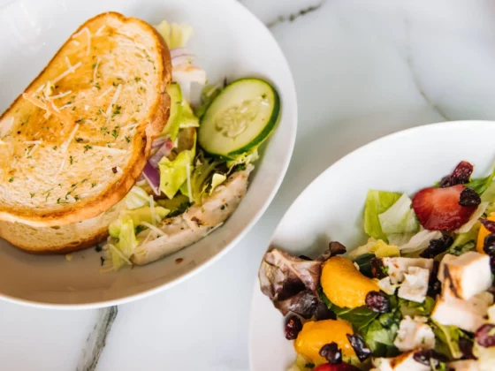 image of sandwiches with salad on a table