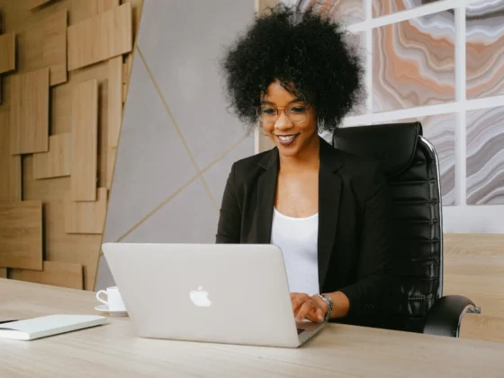 woman smiling using laptop