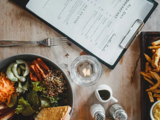 menu and a meal on a table