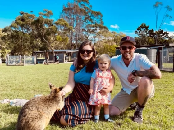 megan ratcliffe shot with her family feeding a kangaroo