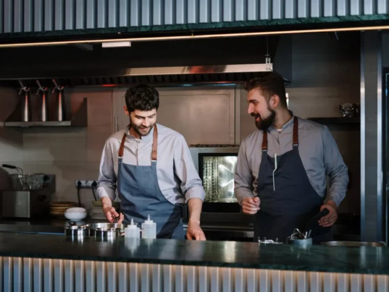 two chefs in a commercial kitchen